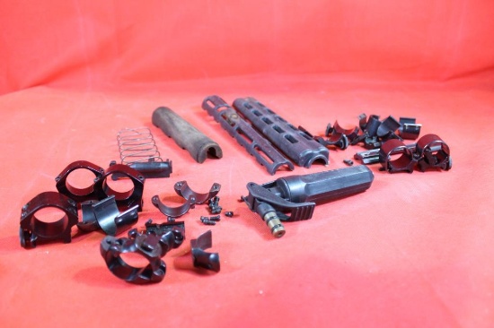 Bag of miscellaneous rings, gun parts and small torch. Used.