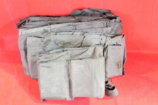 Eleven green military cloth bandoliers. Used. No ammunition.