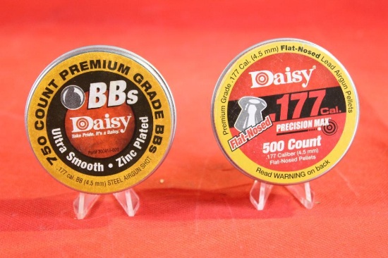 Two tins of Daisy .177 pellets, one round 750 count and one flat nosed 500 count