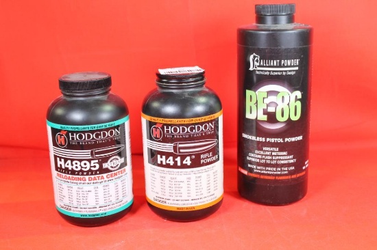 Three bottles of reloading powder. One full and two partial. One Alliant BEW-86 1/2 full, one