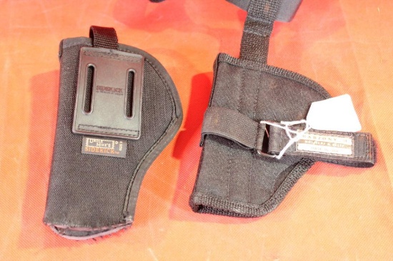 Two black nylon holsters. One right handed belt and one ankle holster. Like new.