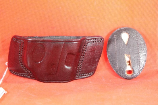 Taurus right handed belt holster for automatic and one Safariland clip and leather badge holder.