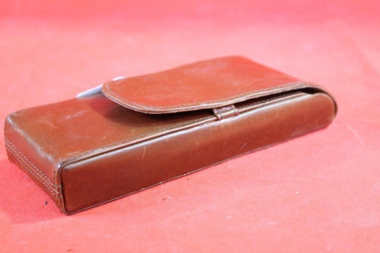 Brown leather cigar case. Holds three cigars. Used in good condition.