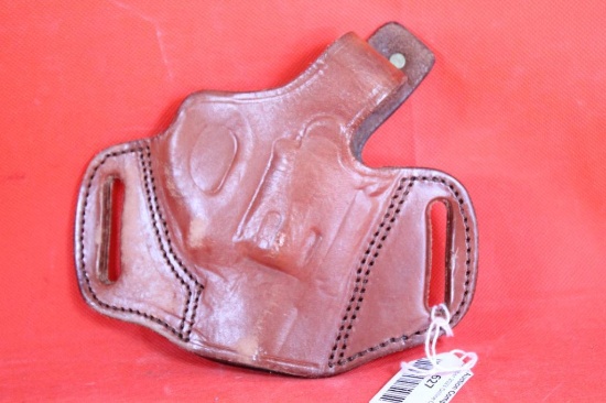 Tagua right handed revolver holster with thumb strap and has FBI cant. Used.