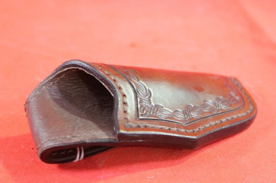 Dark brown leather right handed holster for very small revolver. Used in very nice condition.