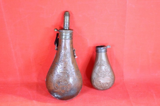 One 1800's Batty Peace copper powder flask and one smaller hunting dog and pheasant copper black