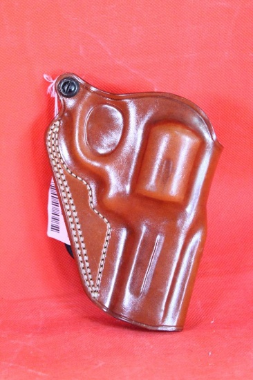 Brown leather Galco right handed paddle holster for revolver. Like new.