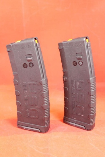 Two black plastic American Tactical AR-15 magazines. Like new.