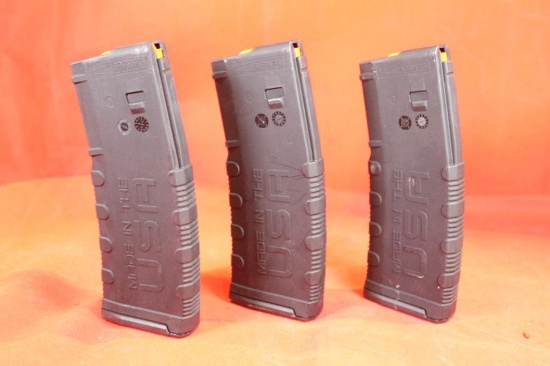 Three black plastic American Tactical AR-15 magazines. Like new.