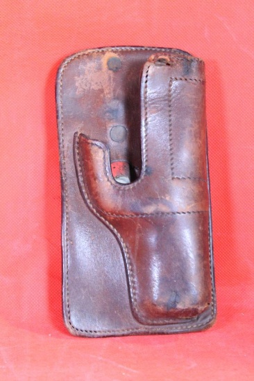 Older Audley leather belt right handed holster with trigger spring clip. Used.