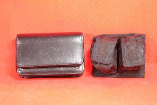 Two black nylon belt speedloader holders and one Hama black leather ammo pouch. Both like new.