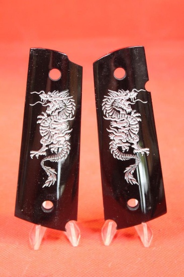Black plastic 1911 grips with Chinese style dragon. Like new.