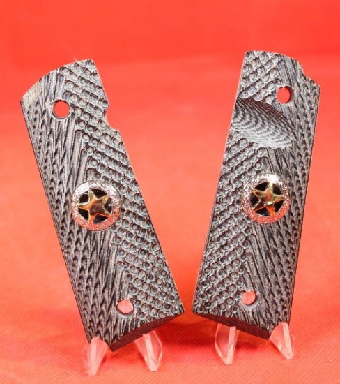 Micarta engraved 1911 grips with gold colored star. Like new.