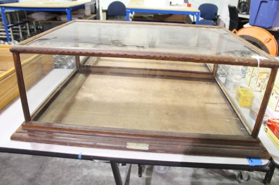 Large glass table top display case with wooden bottom, 31"X 24". Will not ship, pick-up only.