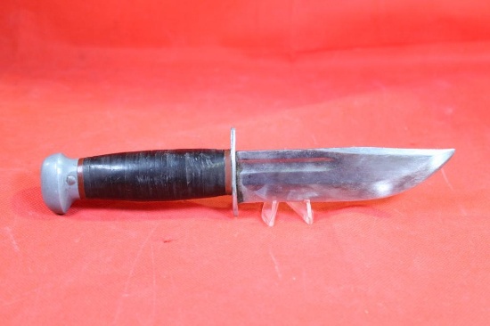 Sheath knife with 5.0 inch blade, stacked leather washer handle. No markings on knife. Handmade