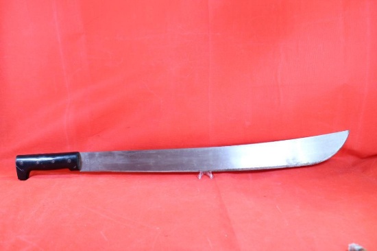 Large Machete with 22 inch blade, black plastic handle. Blade is marked "Legitimus Ollins and Co.
