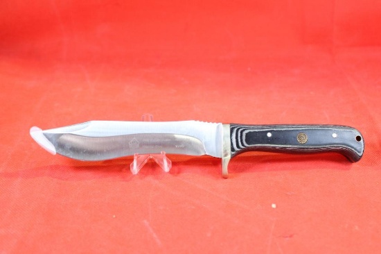 Puma SGB Buffalo Hunter sheath knife with 5.5 inch blade and micarta handle. Nylon sheath. Appears