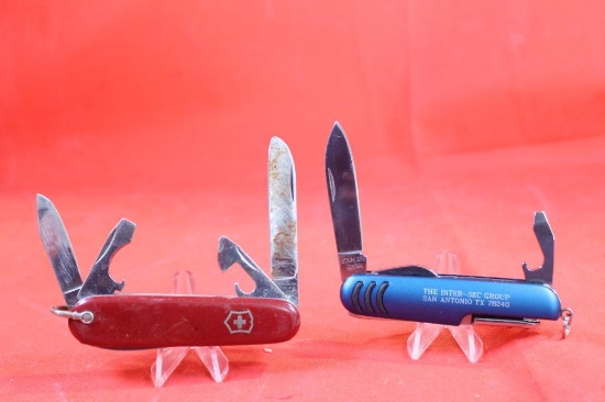Two knives. One Victorinox four blade pocket knife with 2.5 inch main blade. Three other blades