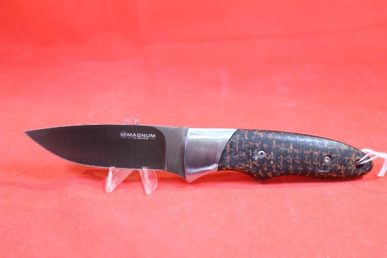 Boker Magnum sheath knife with 3.75 inch blade. Stainless steel and micarta handle. Heavy duty brown