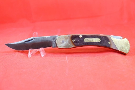 Schrade USA model 7-OT. Lockback hunter with 3.75 inch blade brass handle with sawcut Delrin scales.
