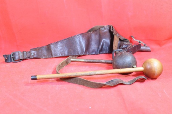 Two black powder bullet starters and rod. Old leather powder horn.