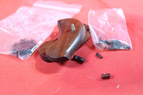 One wood Birdshead pistol grips, moon clips and small gun parts.