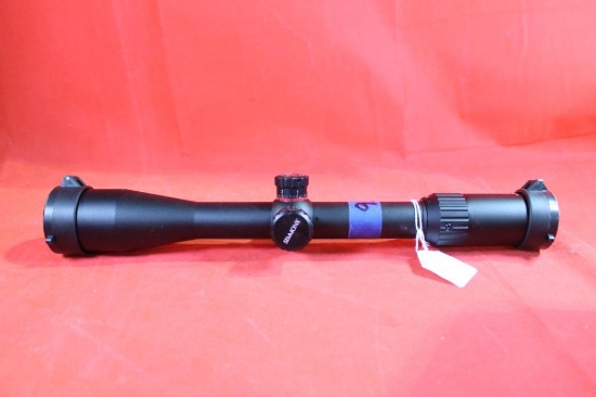 Simmons 6-24x44 rifle scope with tactical turrets and BDC, has flip-up scope covers. Like new.