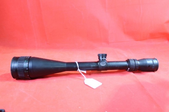 Tasco 10-40x50 with parallax and tactical turrets. Screw-in scope covers. Used in good condition.