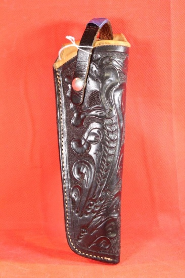 Black tooled leather right handed Ruger 71/2" revolver belt holster. Elk hide lined.Used in nice