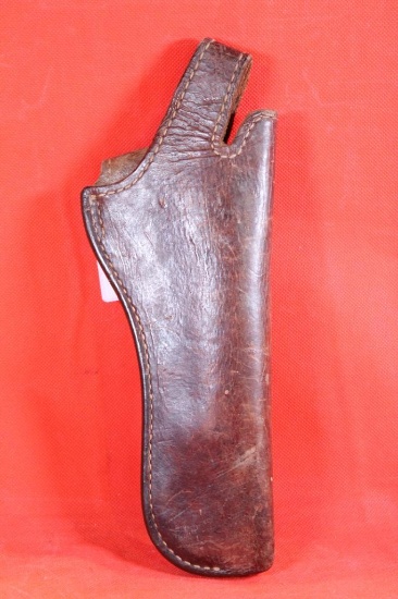 Brown leather right handed belt holster for 4" revolver with snap trigger loop. Used.