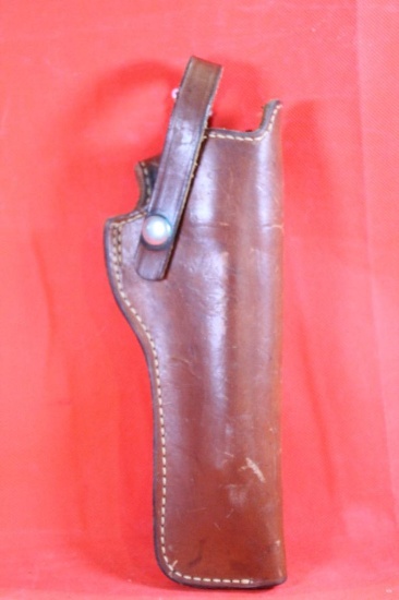 Brown leather S&W right handed belt revolver holster with snap trigger loop. Used.