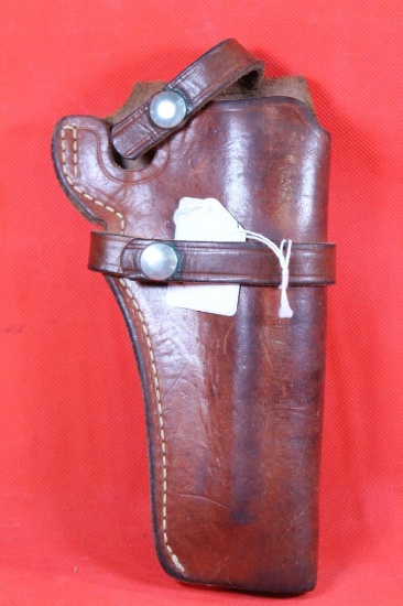 S&W brown leather right handed single strap belt holster with trigger loop. Used.