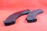 Two black plastic AK magazines.