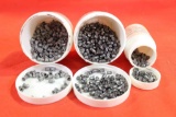 Three containers of 22 cal 5.5mm air rifle pellets.