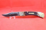 Schrade USA model 7-OT. Lockback hunter with 3.75 inch blade brass handle with sawcut Delrin scales.