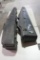Two black plastic scoped rifle cases. One single and one double. Used.