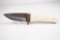 Custom skinner with single 3.25 inch blade. Jipping on back of blade, smooth bone scales. Nice