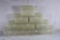 Ten clear plastic rifle ammo boxes.
