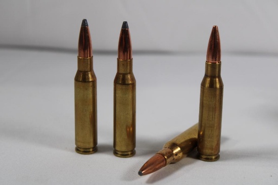 Four plastic boxes of 7MM-08 ammo reloads and brass 37 count ammo and 36 count brass