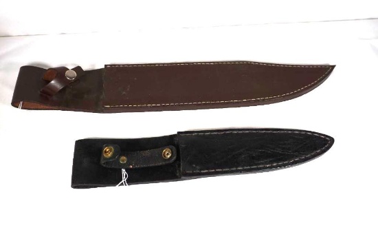 Two leather fixed blade knife sheaths.