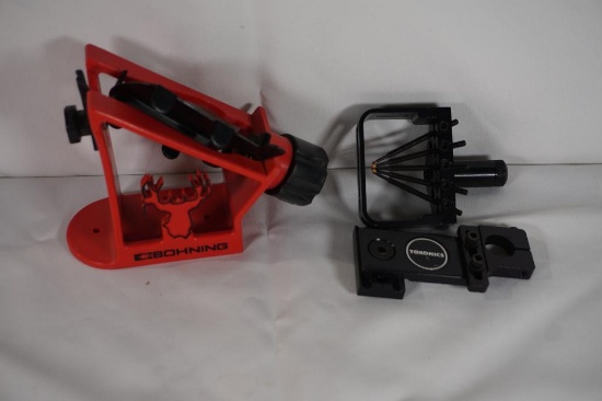 One arrow fletching stand and one bow sight.