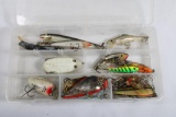 Clear plastic box of miscellaneous fishing lures. Used.