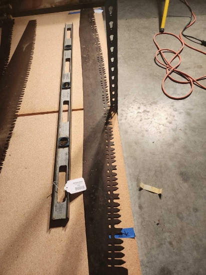 One 5 1/2 foot two man saw blade only and one 4 foot aluminum level. Used.