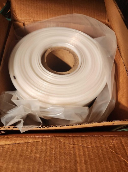 Large roll of plastic sheet wrap.