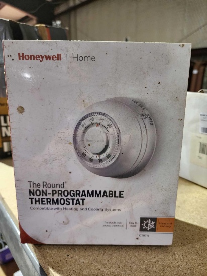 Round non-programmable thermostat. New in package.