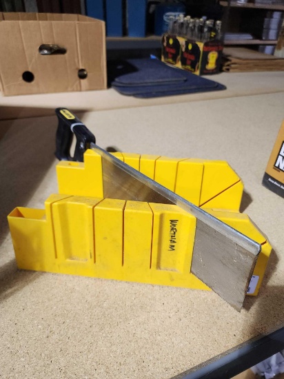 Stanley yellow plastic miter box and miter saw. used, in good condition.