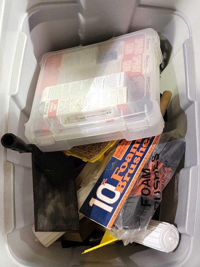 Large plastic tub with miscellaneous items.