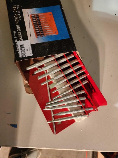 Fourteen piece punch and chisel set. New in box.