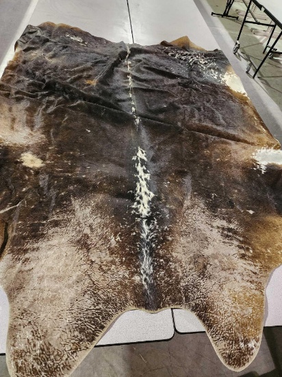 Large cowhide rug. 86" x 72".