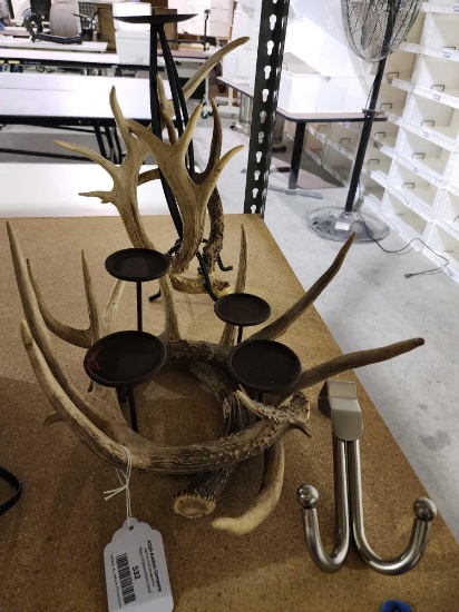 One chrome door hang coat hook, and two decorative antler candle holders.